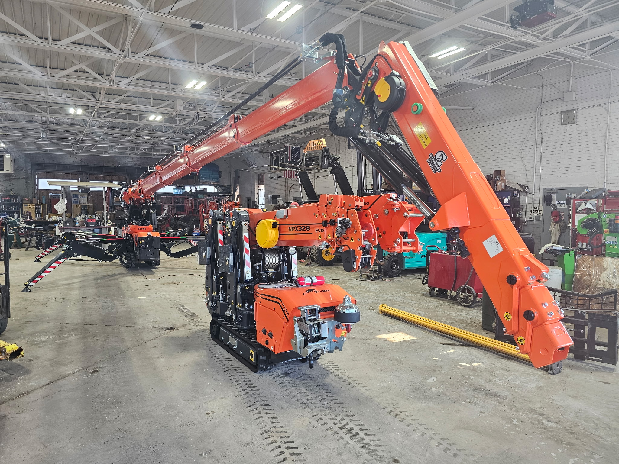 Jekko SPX328 EVO mini crane with boom extended in the CLE service shop