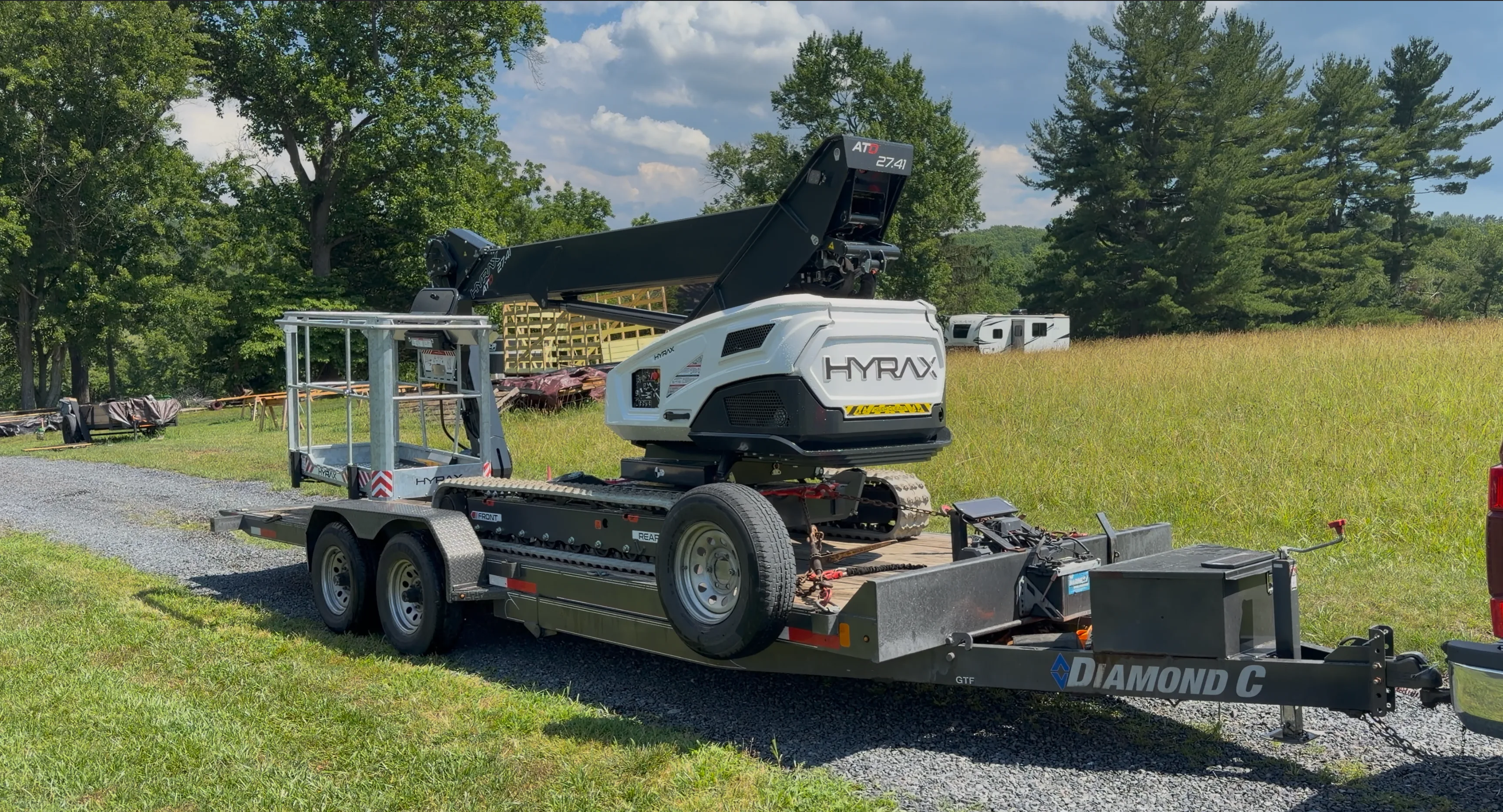 Hyrax 27.41 lightweight tracked aerial lift, towable behind a pickup truck