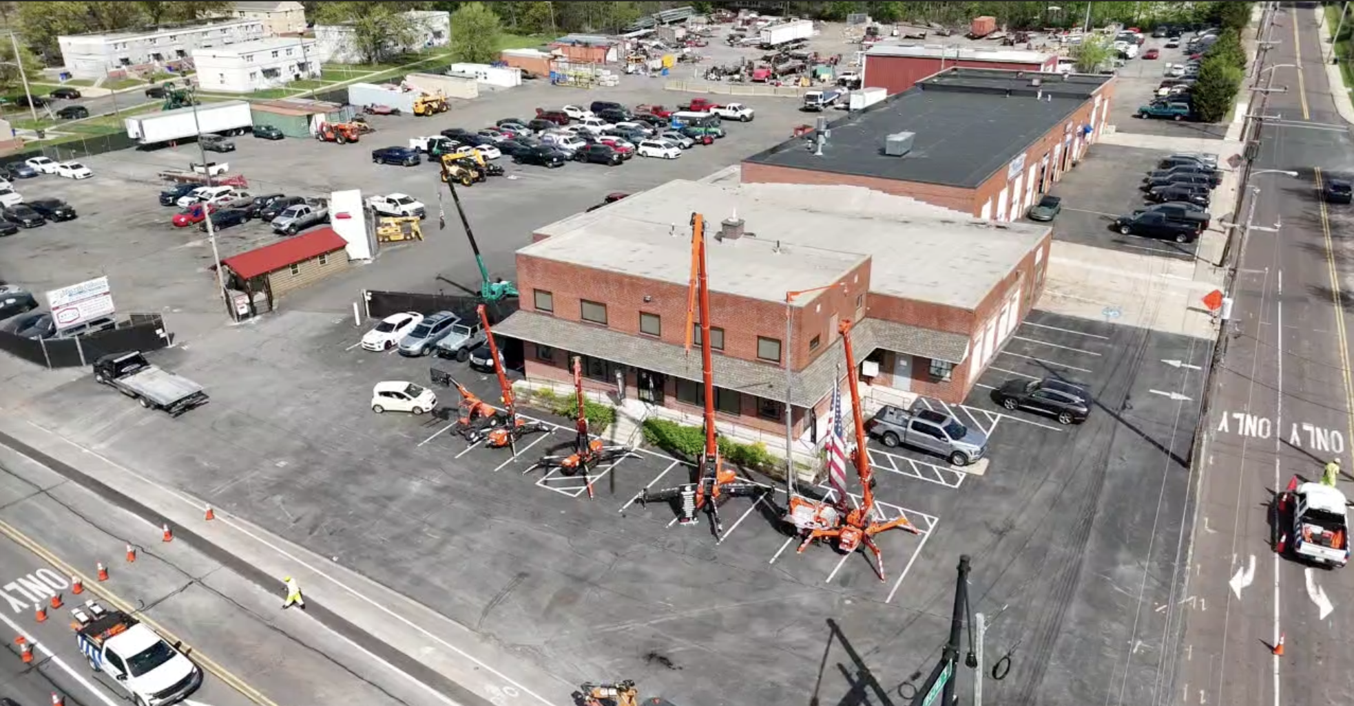 Jekko spider cranes lined up outside the Compact Lifting Equipment yard