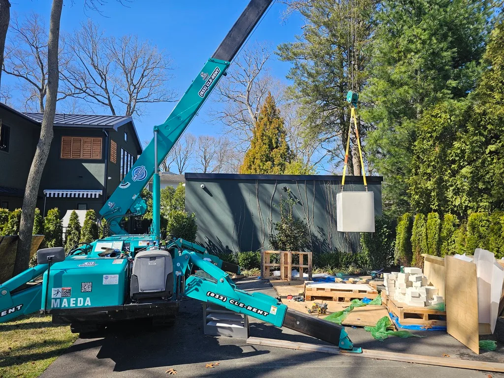 Maeda MC405 mini crane on a customer jobsite, photo 1 of 3