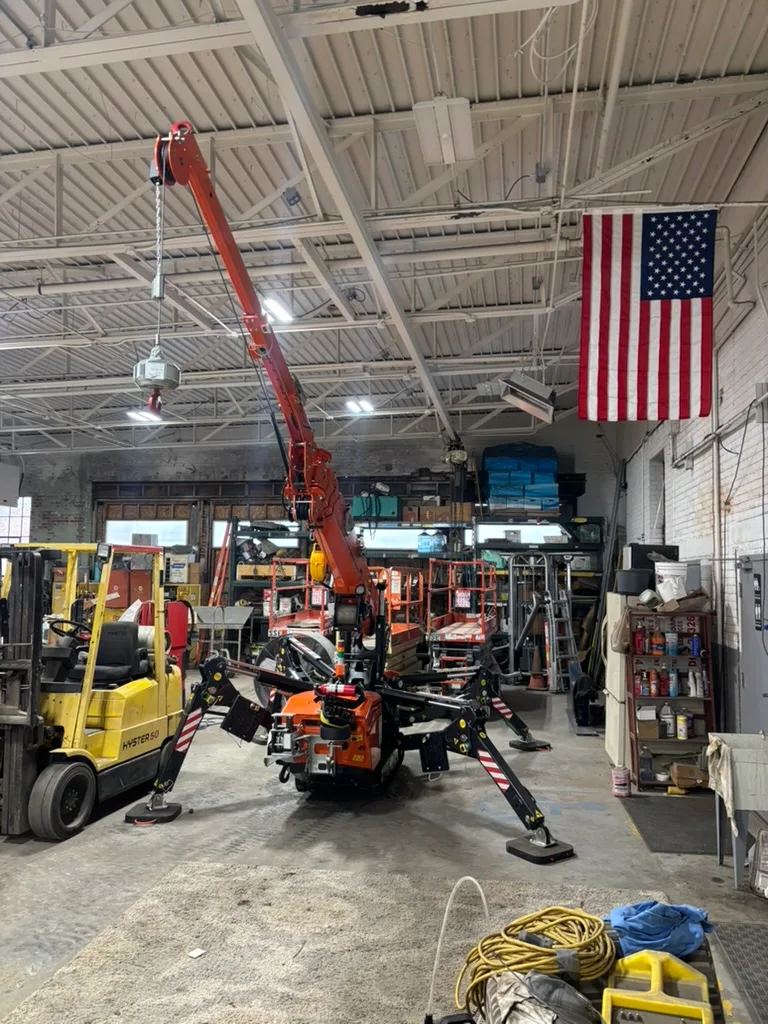 Jekko SPX328 EVO set up with boom raised inside the CLE service shop